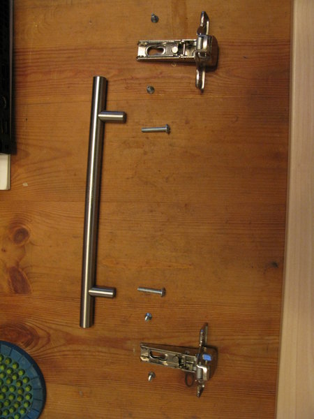 The fittings from the original cupboard door